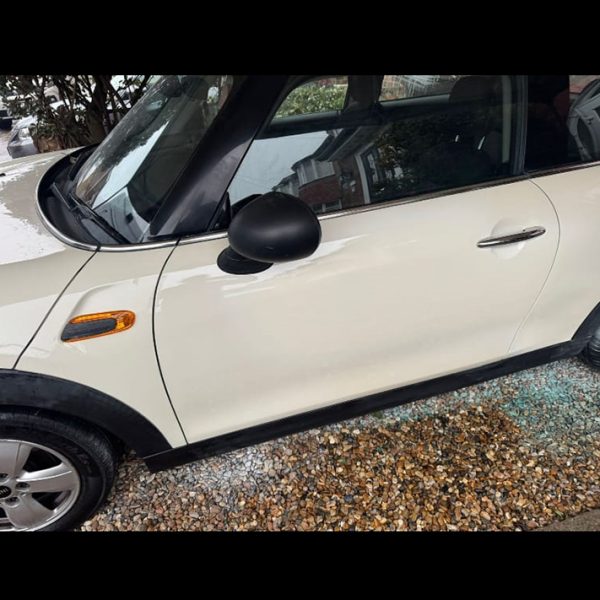 Car door panel dent and paint repair service by Autoscratch restoring smooth body finish