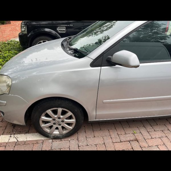 Car front door and fender dent repair service by Autoscratch restoring vehicle body panel to original condition