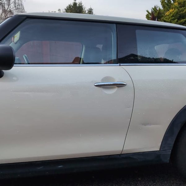 Car side door dent and scratch repair service by Autoscratch restoring vehicle body panel damage